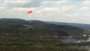 The Bandit booster being recovered on a seperate parachute.
